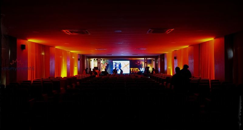 The hall lit in red and amber before the audience arrives